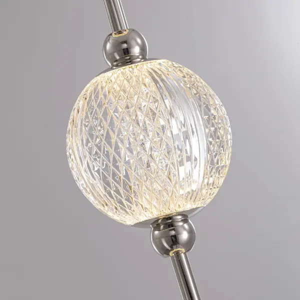 The Marni 38-inch vanity light features meticulously cut spherical glass shades that create stunning beams of light. With integrated LED technology and transitional styling, it adds luxury to bathrooms and beyond. - alternate view