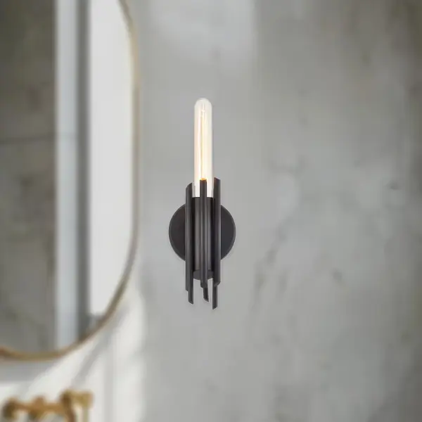 The Torres 9-inch vanity light brings brutalist architectural influence to bathroom and hallway lighting. Forged metalwork in matte black finish pairs beautifully with optional ribbed crystal shades for versatile modern or transitional styling. - alternate view