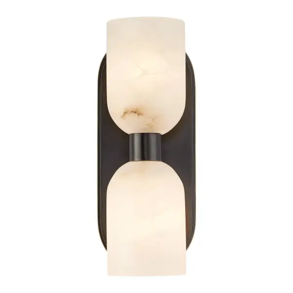 The Lucian vanity light blends antique-inspired shapes with modern touches, featuring organically curved backplates and natural alabaster shades. Its transitional design works beautifully in bathrooms and beyond, with flexible up or down mounting.