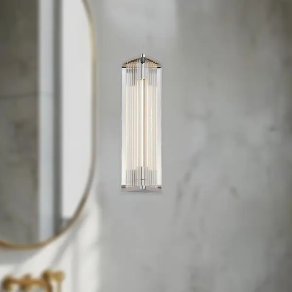 The Sabre vanity light combines forged metal with innovative LED filament tubes for a sophisticated, modern aesthetic. Its 12-inch profile makes it ideal for smaller bathrooms and powder rooms while delivering warm, dimmable illumination. - alternate view