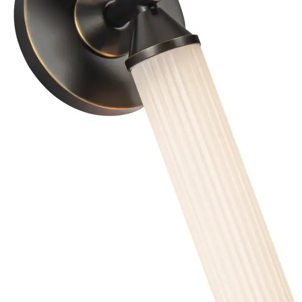 The Edwin vanity light brings timeless Art Deco elegance to contemporary spaces with its ribbed frosted glass and vintage brass finish. Integrated LED technology provides energy-efficient illumination while maintaining period-authentic aesthetics. - alternate view