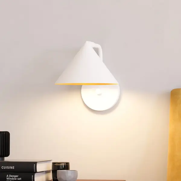 The Remy vanity light brings Japanese design sensibility to modern bathrooms with its distinctive triangular shades and brushed gold finish. Perfect for adding sophisticated style to powder rooms and hallways. - alternate view