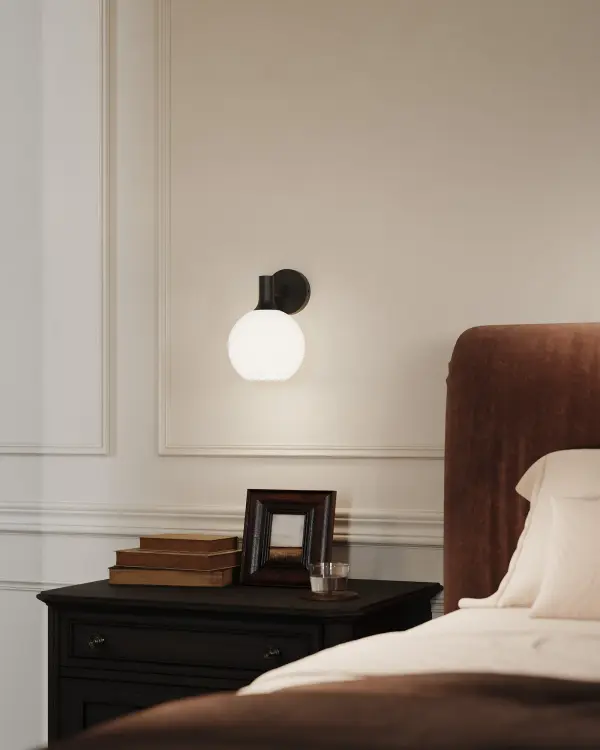 The Castilla 8-inch vanity light combines classic chic styling with practical versatility. Its matte black finish and opal glass create a timeless look that transitions seamlessly from fresh farmhouse to eclectic designs. - alternate view