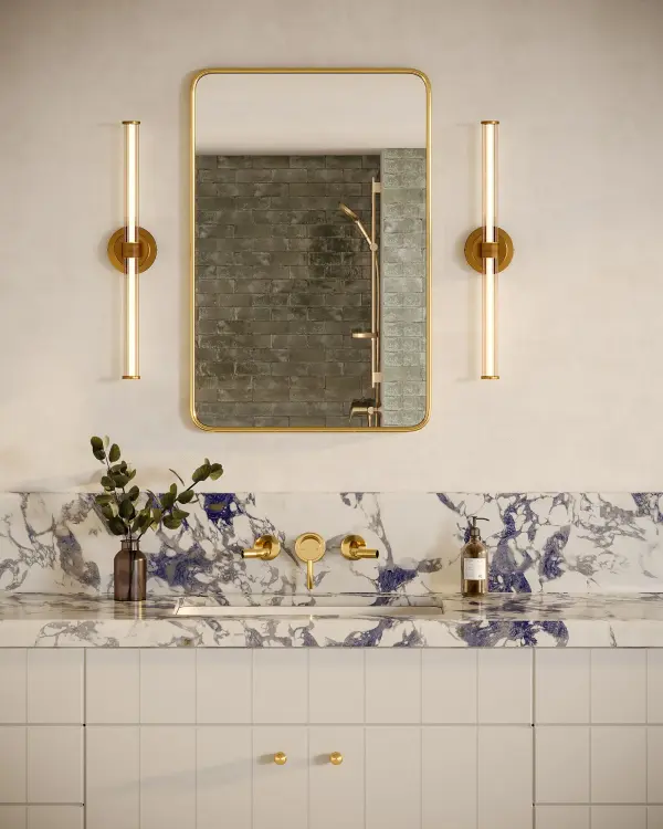 The Elsie vanity light combines streamlined contemporary design with refined decorative touches. Its 24-inch bar features clear ribbed glass shades and jewelry-like metal detailing, creating sophisticated ambient lighting perfect for bathrooms and hallways. - alternate view