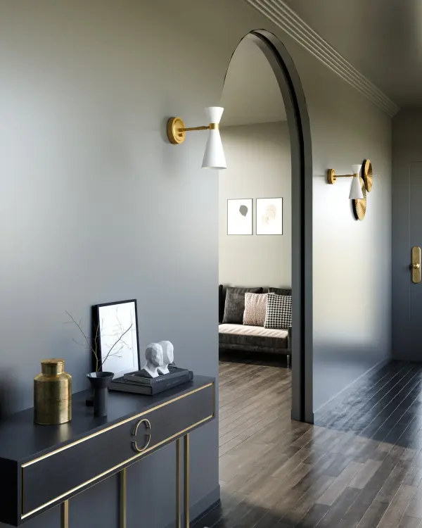 The Blake vanity light brings Art Deco glamour to modern bathrooms with its distinctive bowtie-inspired geometric shade. The striking combination of Aged Gold accents against Matte Black creates visual interest while providing ample illumination. - alternate view