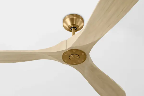 The Maverick Smart 60" combines sophisticated design with cutting-edge technology. Its gracefully curved washed white oak blades and burnished brass housing create a striking focal point while delivering efficient airflow and seamless smart home integration. - alternate view