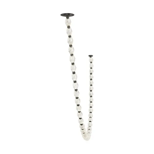 A dramatic 9.5-foot chandelier featuring Czech crystal and brass connectors that creates a breathtaking vertical light sculpture. The integrated LED design delivers exceptional illumination while the faceted crystals refract light beautifully.