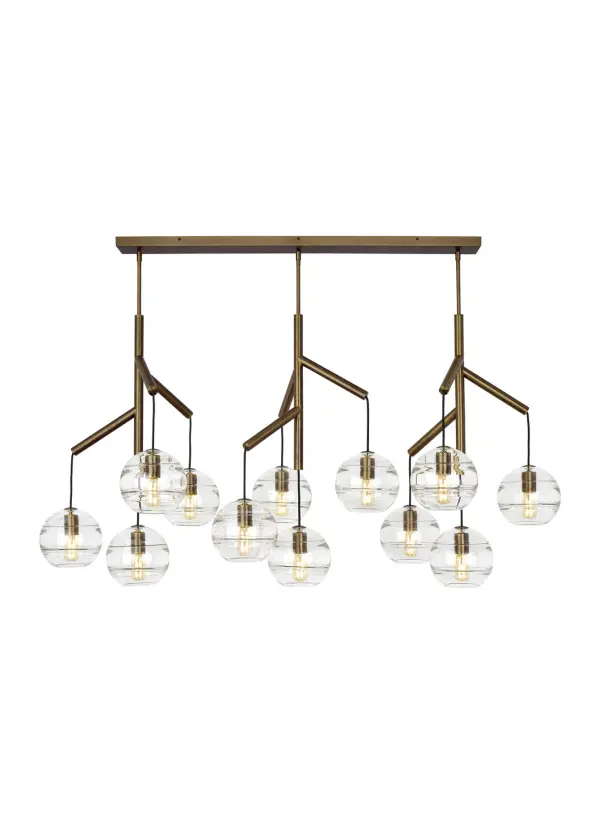 The Sedona Triple transforms the traditional chandelier into a contemporary statement piece with twelve handcrafted glass orbs suspended from a sleek central hub. The artisan-crafted interior glass bands create dimensional visual interest while the aged brass finish adds warmth.