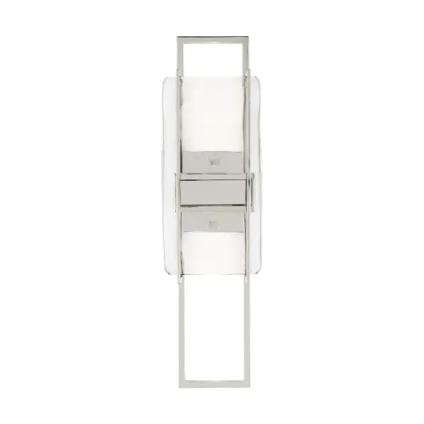 The Duelle by Mick De Giulio combines refined industrial design with warm LED illumination. Its pressed art glass and polished nickel finish create sophisticated ambiance through concealed up and down lighting, perfect for modern interiors.
