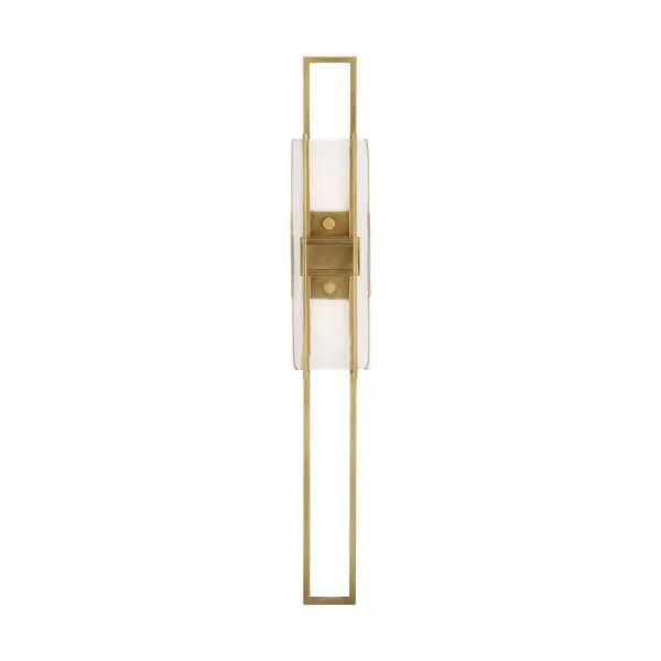 The Duelle wall sconce by Mick De Giulio combines industrial elegance with refined simplicity. Its 28-inch vertical profile creates dramatic height while concealed LEDs cast warm light up and down through pressed art glass.
