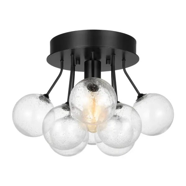 The Bronzeville semi-flush mount delivers authentic mid-century modern style with its hand-blown seeded glass globe and midnight black finish. Designer Sean Lavin's creation diffuses light beautifully while maintaining a compact 10-inch profile ideal for lower ceilings.
