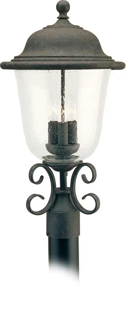 The Trafalgar outdoor post lantern combines traditional design with durable construction. Its oxidized bronze finish and three-light configuration provide ample illumination for pathways, driveways, and outdoor spaces.