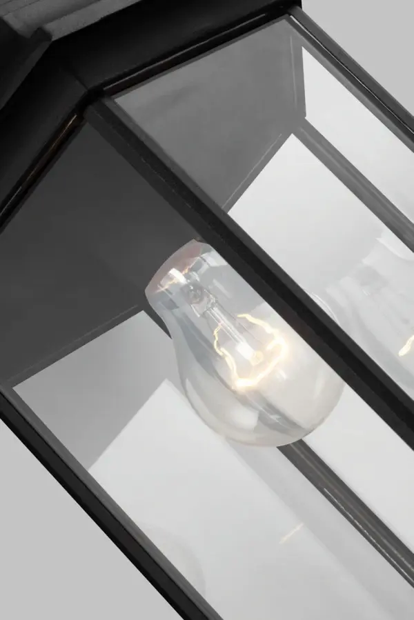 The Sevier Large Wall Lantern combines timeless design with practical downlight illumination. Its black finish and substantial size make it ideal for exterior entryways and covered outdoor spaces. - alternate view