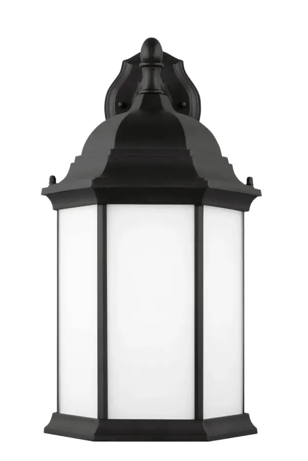 The Sevier Large Down Wall Lantern combines traditional lantern styling with modern durability. Its black finish and clear glass panels provide excellent downward illumination for outdoor spaces while maintaining curb appeal. - alternate view