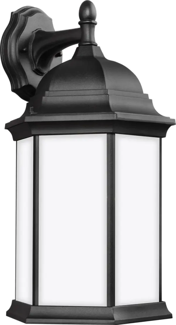 The Sevier Large Wall Lantern combines traditional lantern styling with contemporary downlight functionality. Its black finish and clear glass panels create a versatile outdoor lighting solution. - alternate view