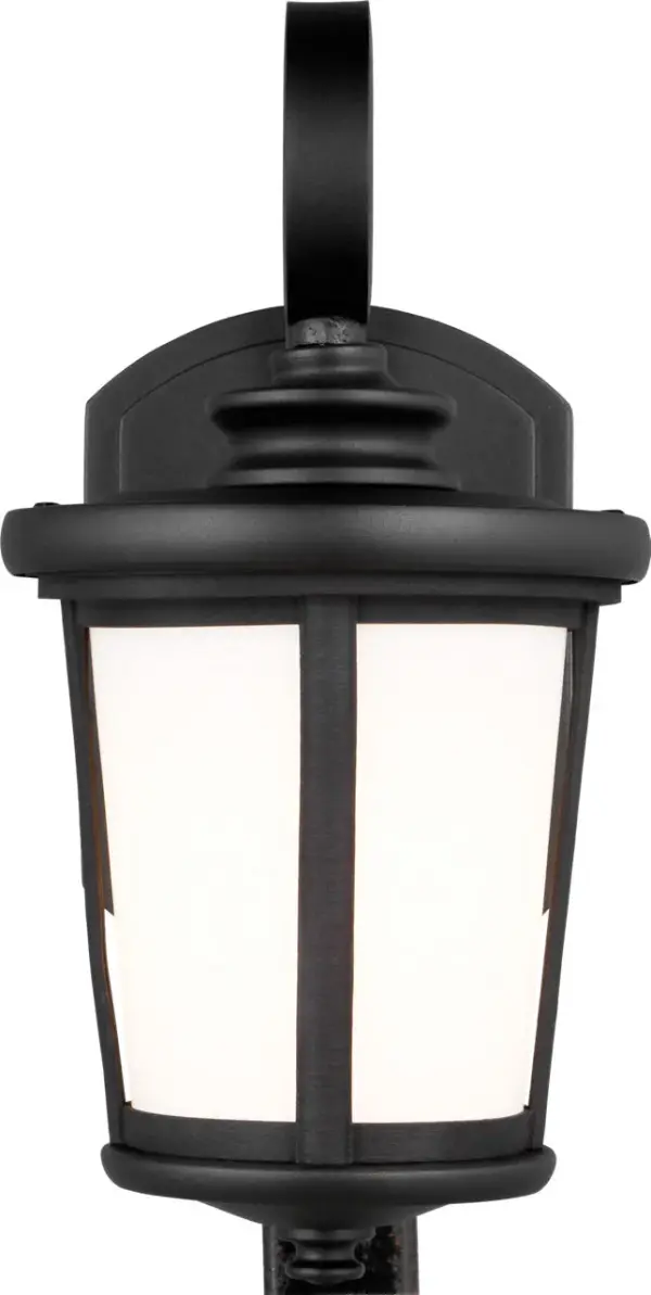 The Eddington Small Outdoor Wall Lantern combines traditional lantern styling with a durable textured black finish. Its compact size makes it ideal for smaller entryways, porches, and side doors while providing reliable outdoor illumination. - alternate view