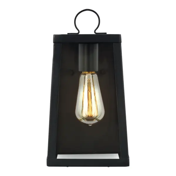 The Marinus wall lantern combines a squared-off modern silhouette with vintage-style bulb appeal. Its textured Blacksmith finish and clear glass create a welcoming outdoor presence that works across traditional and contemporary homes.