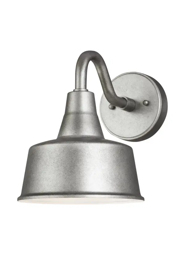 This handcrafted aluminum wall lantern delivers authentic barn-style charm with modern LED efficiency. The weathered pewter finish adds rustic character while the wet-rated construction ensures reliable performance in any weather.