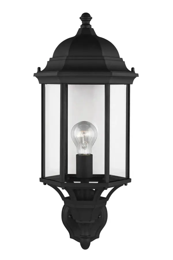 The Sevier Large Wall Lantern delivers contemporary outdoor lighting with its uplight design and clean black finish. Perfect for illuminating entryways and outdoor living areas with modern architectural appeal.