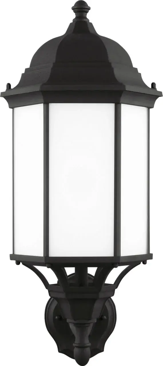 The Sevier Large Up Wall Lantern combines traditional lantern styling with contemporary upward illumination. Its black finish and clear glass panels create a versatile outdoor lighting solution. - alternate view