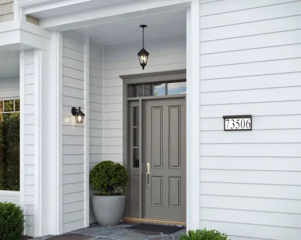 This compact address light housing delivers clean, contemporary styling in a durable textured black finish. Perfect for illuminating house numbers with modern appeal, it includes bulbs for immediate installation. - alternate view