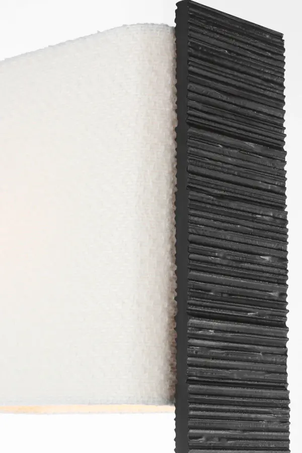 The Fumar 55" floor lamp commands attention with its distinctive ridged carbon finish and sophisticated bouclé shade. This statement piece balances bold sculptural presence with refined texture, making it ideal for contemporary spaces. - alternate view