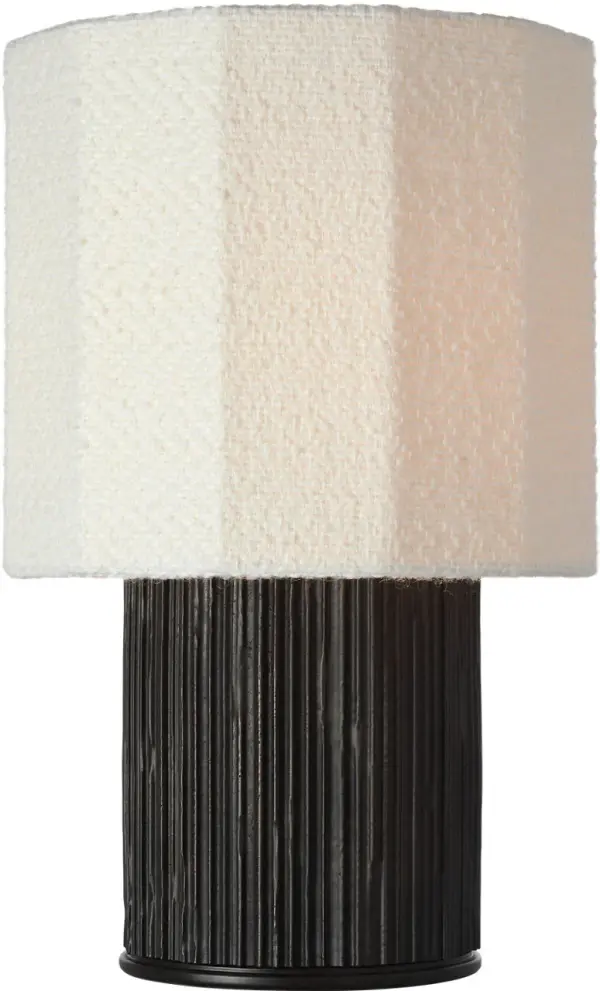 The Fumar table lamp combines contemporary elegance with organic texture through its distinctive ridged carbon ceramic base and soft bouclé fabric shade. At 18" tall, it provides ideal ambient lighting for living spaces and bedrooms. - alternate view