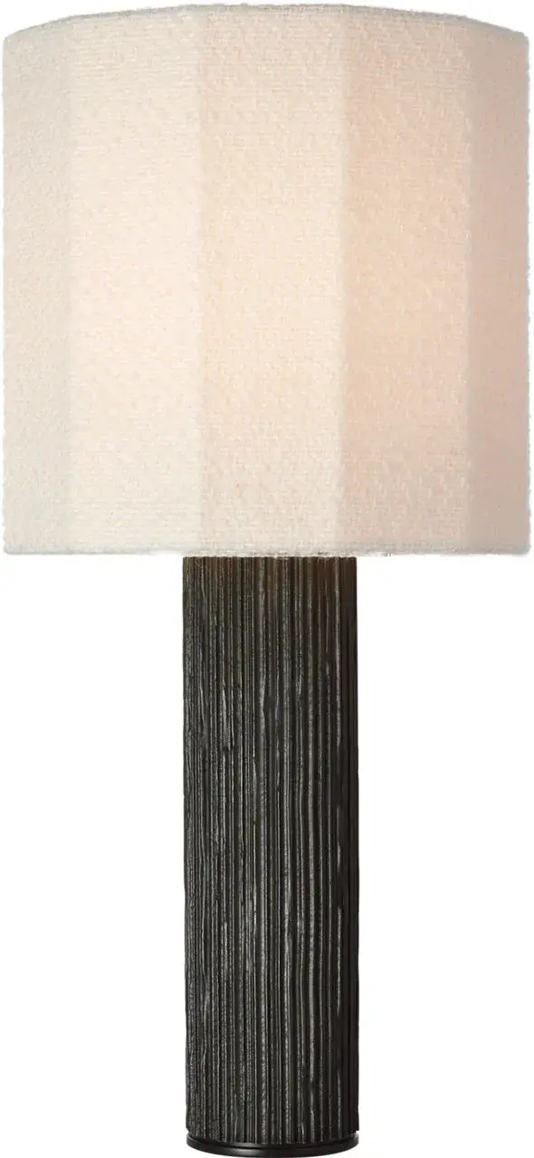 The Fumar table lamp combines a striking ridged carbon ceramic base with a soft bouclé shade, creating a perfect balance of texture and form. At 29" tall, it makes a bold statement while maintaining versatility.