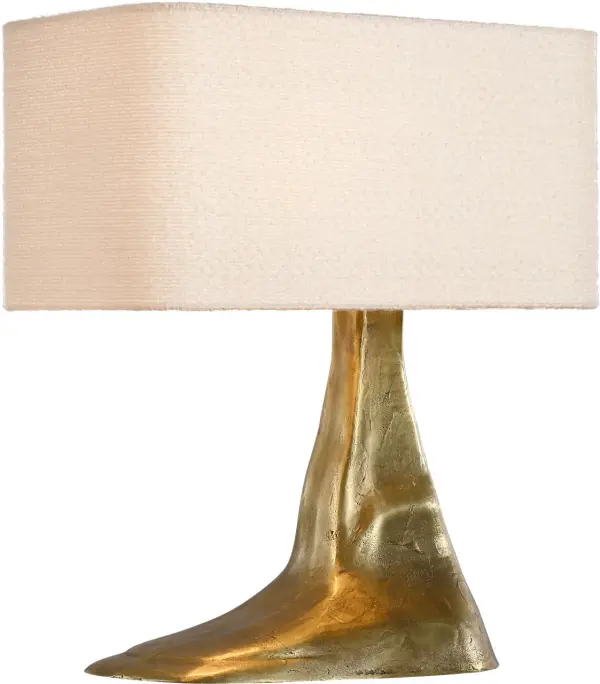 The Terra-Forma table lamp combines museum-quality brass craftsmanship with an organic, sculptural silhouette. The boucle fabric shade adds warmth and texture, making it a sophisticated accent piece for modern interiors.