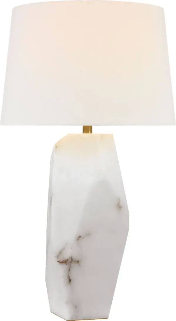 The Crystallo table lamp transforms natural alabaster into a stunning faceted sculpture that doubles as functional lighting. At 32" tall, this statement piece combines organic beauty with contemporary design.