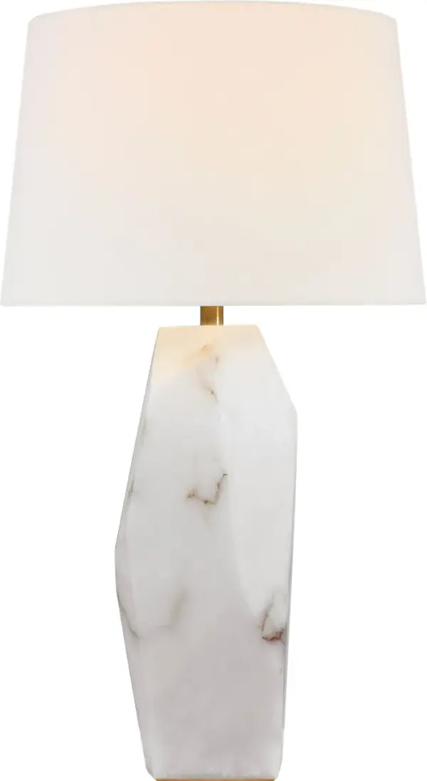 The Crystallo table lamp transforms natural alabaster into a stunning faceted sculpture that doubles as functional lighting. At 32" tall, this statement piece combines organic beauty with contemporary design. - alternate view