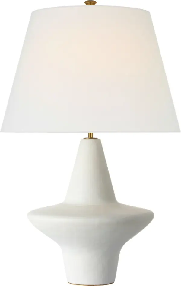 The Mathis table lamp features a beautifully sculpted ceramic body in soft Chantilly white, paired with a classic linen shade. At 29" tall, it provides substantial presence while maintaining refined proportions perfect for sophisticated interiors.