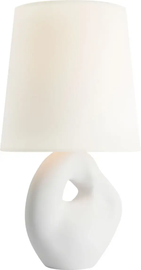 The Adria table lamp combines a sophisticated plaster white ceramic base with a classic linen shade, creating a versatile lighting solution that complements both traditional and contemporary interiors. - alternate view