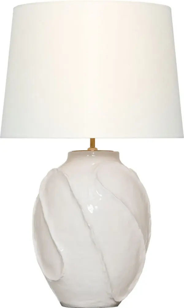 The Idalia brings sophisticated texture and organic form to any space with its distinctive glossy white crackle ceramic base and classic linen shade. At 28" tall, it provides ideal task and ambient lighting for bedrooms and living areas.