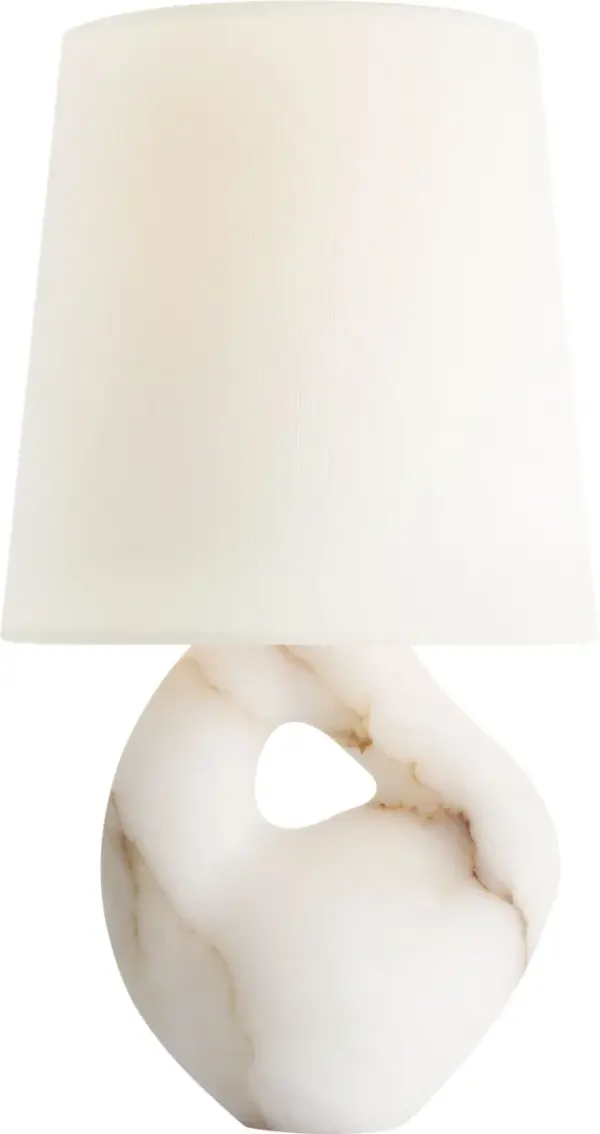 The Adria table lamp showcases the timeless beauty of natural alabaster stone paired with a classic linen shade. At 16 inches, it provides sophisticated ambient lighting perfect for bedside tables and living spaces.