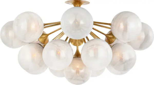 The Cristol 43" flush mount by AERIN delivers dramatic illumination for larger spaces with its oversized profile and hand-blown strié glass globes. The sculptural antique brass finish adds refined elegance. - alternate view