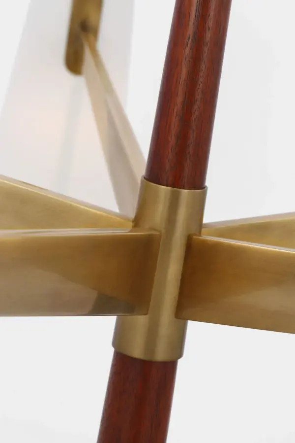 The Olina chandelier combines hand-rubbed antique brass with rich mahogany wood details and soft linen shades, creating a refined statement piece that bridges traditional elegance and organic modern sensibility. - alternate view