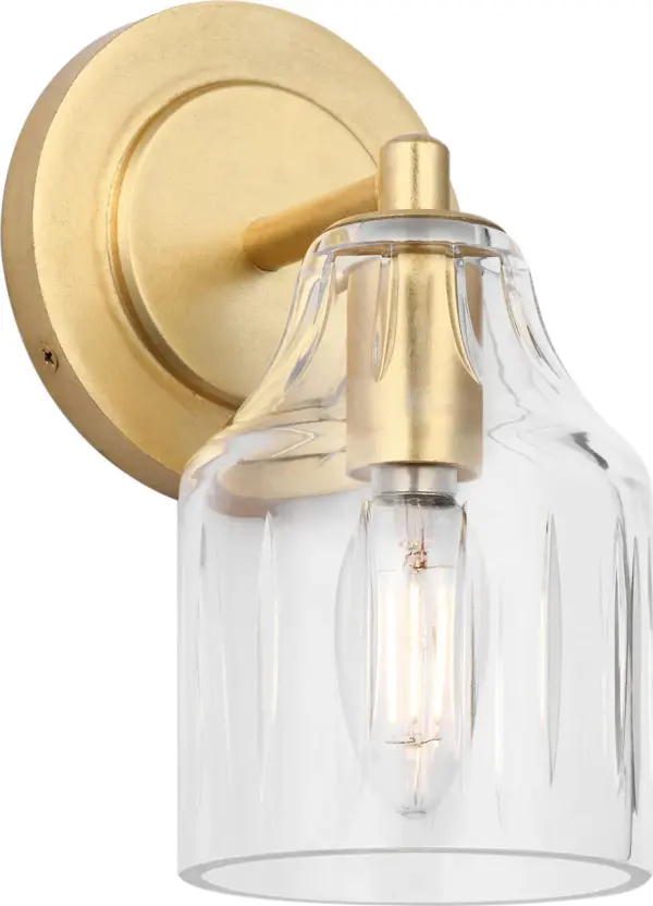 The Augusta 8" Bath Sconce by Alexa Hampton delivers timeless sophistication in a compact profile. Featuring blown glass with tactile texture and a stepped backplate, this fixture brings architectural clarity to powder rooms and vanities.