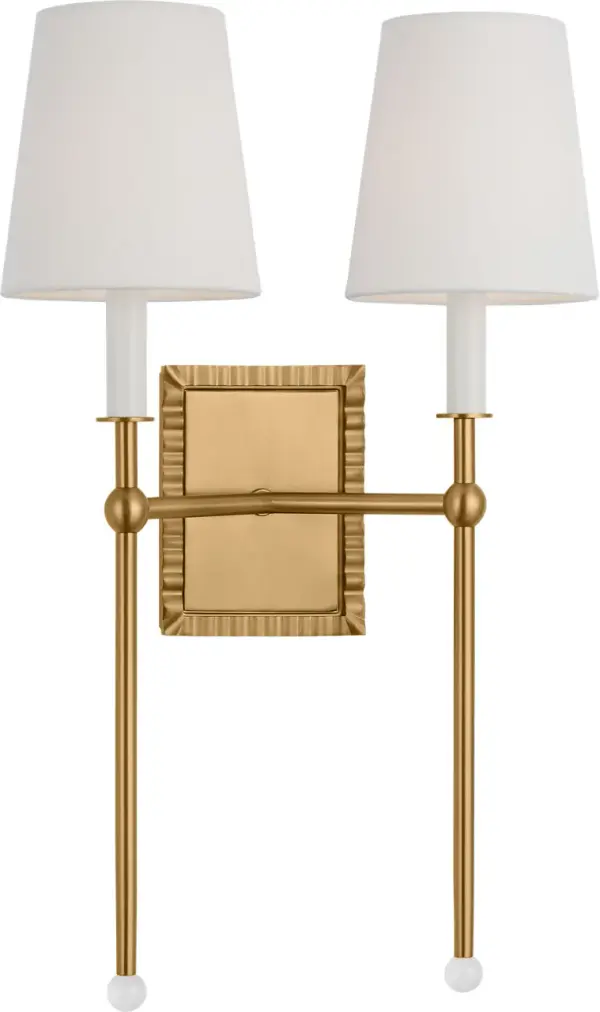 The Baxley wall sconce by Alexa Hampton masterfully blends traditional elegance with modern design elements. Its distinctive exaggerated stem topped with a crystal ball creates visual interest, while the burnished brass finish adds warmth. - alternate view
