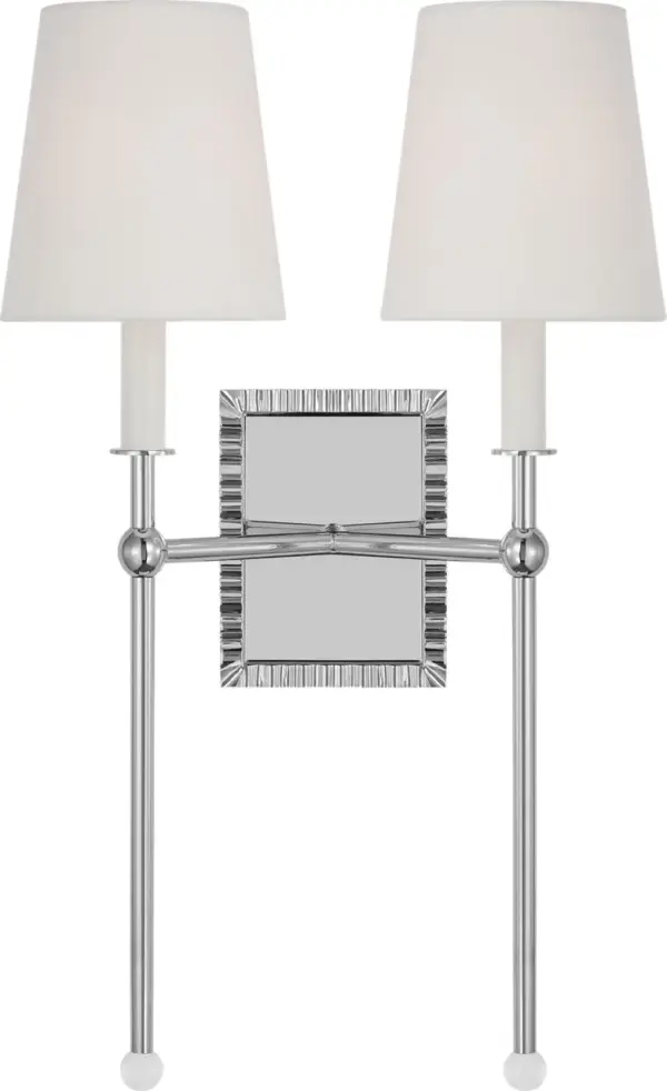 The Baxley wall sconce by Alexa Hampton masterfully blends traditional elegance with contemporary design through its exaggerated stem and crystal ball detail. Perfect for bathroom vanities or hallways, this fixture delivers sophisticated lighting.