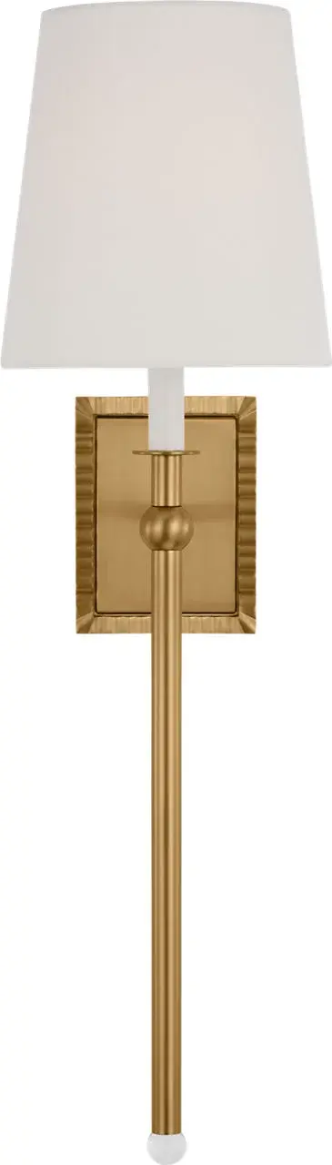 The Baxley sconce by Alexa Hampton combines traditional elegance with modern flair. Its exaggerated stem topped with a crystal ball creates a sophisticated focal point, while the burnished brass finish adds warmth and luxury.