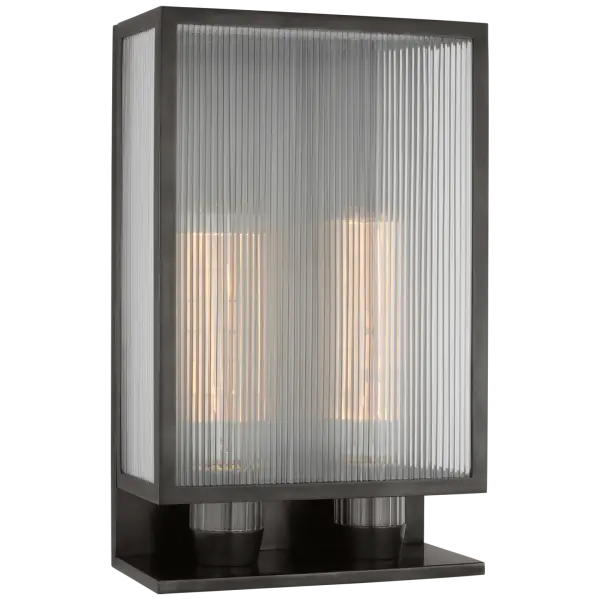 The York 16" Double Box Outdoor Sconce combines traditional craftsmanship with durable outdoor construction. Its clear ribbed glass panels and bronze finish create elegant illumination for entryways and exterior walls.