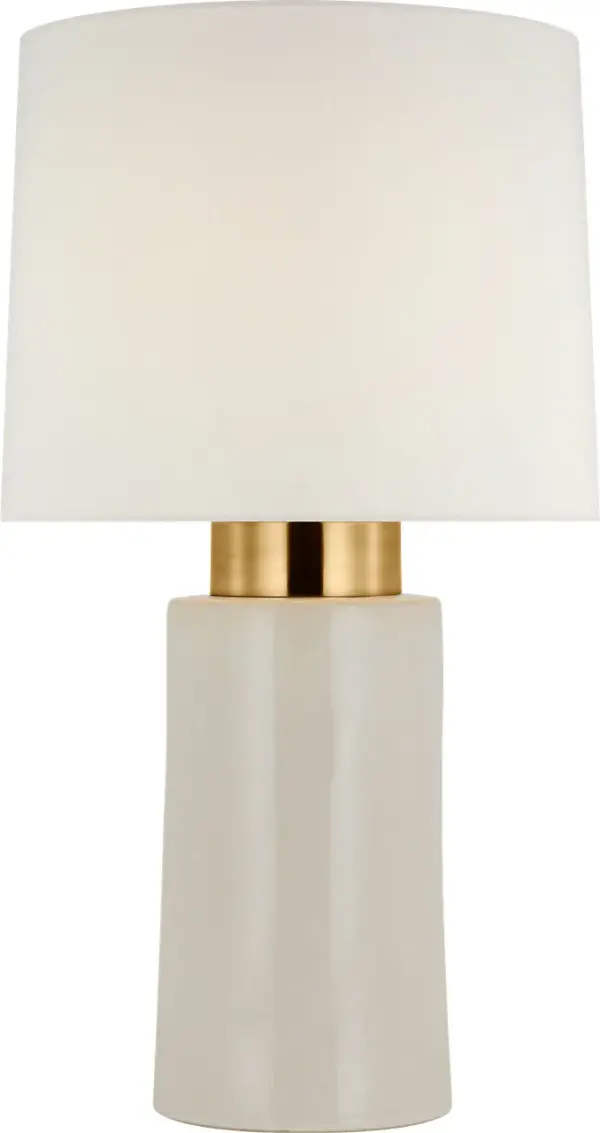 The Xian 30" table lamp combines classic elegance with contemporary sensibility. Its ivory ceramic base paired with soft brass accents creates a refined look, while the linen shade provides warm, diffused lighting perfect for living spaces.