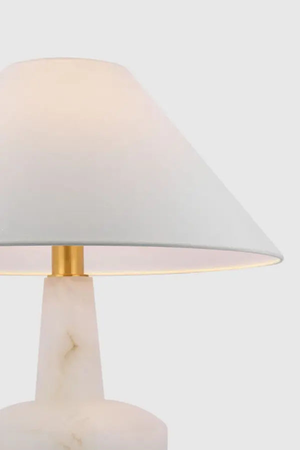 The Paros 31" table lamp showcases the natural beauty of alabaster stone with a sophisticated linen drum shade. Its substantial height and organic material create a luxurious focal point perfect for transitional and coastal-inspired interiors. - alternate view