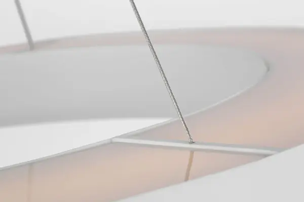 The Neptune chandelier makes a bold architectural statement with its 48-inch ring silhouette and uplight configuration. The matte white finish provides a clean, contemporary aesthetic that complements modern interiors while delivering ambient illumination. - alternate view