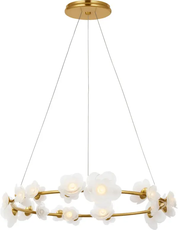 The Petaluma Ring Chandelier transforms any space with its 35-inch diameter ring adorned with handcrafted glass flowers. The soft lacquered brass finish provides warmth while the etched and clear glass petals create captivating light play.