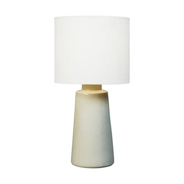 Barbara Barry's Vessel table lamp combines modern simplicity with organic warmth through its ceramic construction and earthy Shellish Grey finish. The clean, well-proportioned form and white linen shade create a versatile piece that seamlessly integrates into contemporary and transitional interiors.