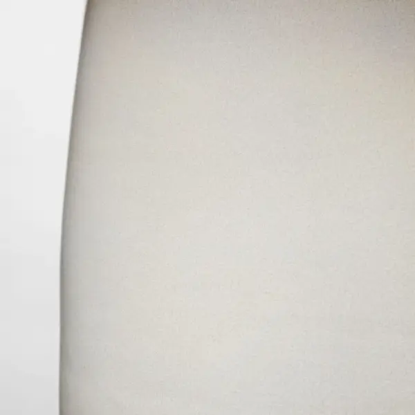 The Roma Table Lamp by Barbara Barry combines timeless elegance with modern sensibility. Its elongated oval ceramic base in Shellish Gray paired with a tailored linen shade creates warm, diffused lighting perfect for refined interiors. - alternate view