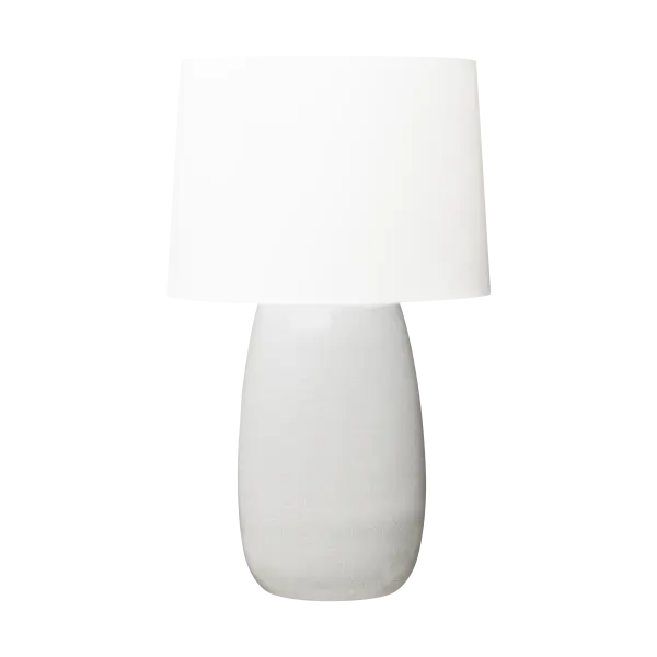 Barbara Barry's Roma Table Lamp combines an elegant elongated oval ceramic base with a tailored linen shade, creating a refined lighting solution that bridges modern and traditional aesthetics with timeless appeal. - alternate view