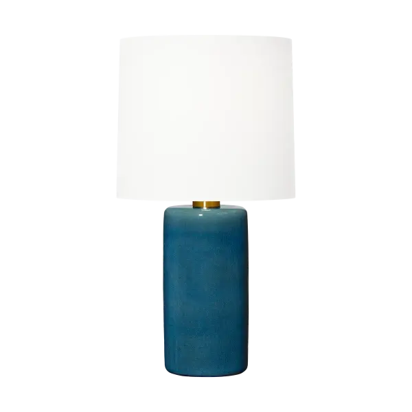Barbara Barry's Shanghai Table Lamp combines a sleek cylindrical ceramic base with a refined crackle finish and tailored linen shade. Its understated elegance and soft illumination make it ideal for modern and transitional spaces.
